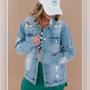 light-wash, distressed denim jacket with rips on the sleeves and front panels